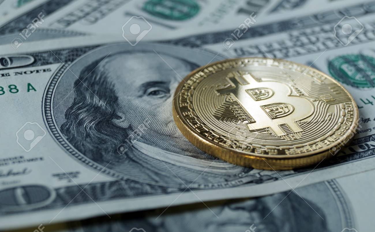 A Symbolic Coins Of Bitcoin On Banknotes Of One Hundred Dollars - 